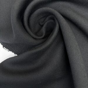 Laine noire 100 % en double tissage, vue lisière et épaisseur pour manteau